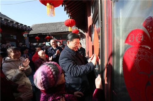 Xi Visits Cadres, Residents in Beijing Ahead of Spring Festi